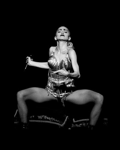 Madonna, Tokyo, Japan, 1990 sitting on a chair