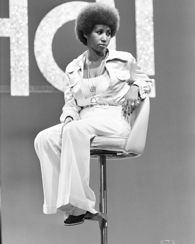 Aretha Franklin, Hollywood, 1973, sitting on a chair
